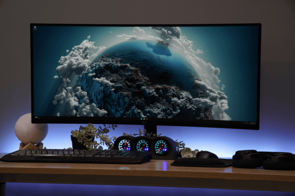 High-resolution monitor showcasing the Lumen Dash Founder’s Edition with a dynamic Earth and cloud scene, emphasizing innovative technology and modern design.
